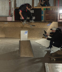 A skateboarder performing a trick on the ramps at Spit & Sawdust