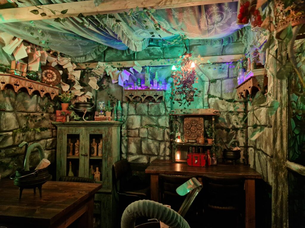 A richly adorned room with a gothic, apothecary theme