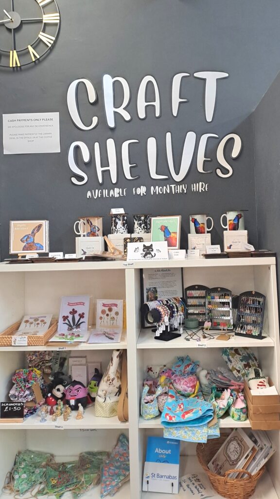 Photograph of Nettleham Community Hub's Craft Shelves, showcasing jewellery and other crafted items.